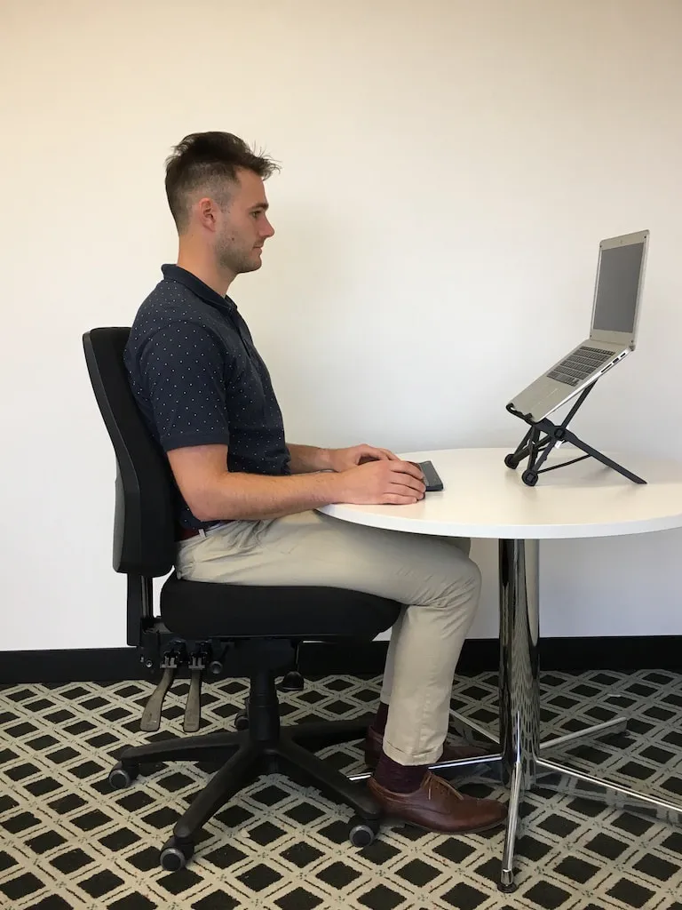 Narrow desk ledge beside tall daylight with minimal objects